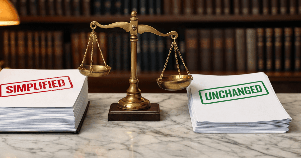 Two regulatory documents with simplified and unchanged stamps on a formal desk